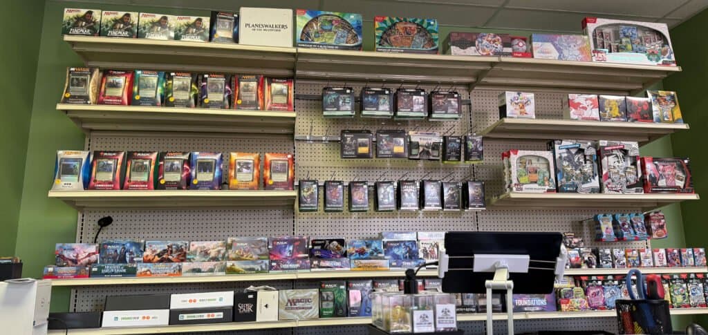 Trading card products on shelves at Golden Lair Games